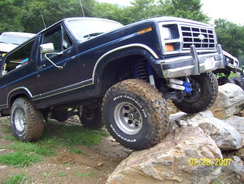 1978 Ford Bronco - This Ford Bronco is navigating a rocky trail, showing off its off-road capabilities.