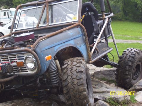1978 Ford Bronco - This heavily modified vehicle features a roll cage and large off-road tires, suggesting it's built for extreme terrain.