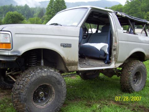 1978 Ford Bronco - This modified Ford Bronco features large off-road tires and a roll cage, seen outdoors on 07/28/2007.