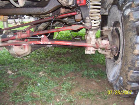 1978 Ford Bronco - This photo shows the undercarriage and wheel assembly of a vehicle, likely taken off-road.