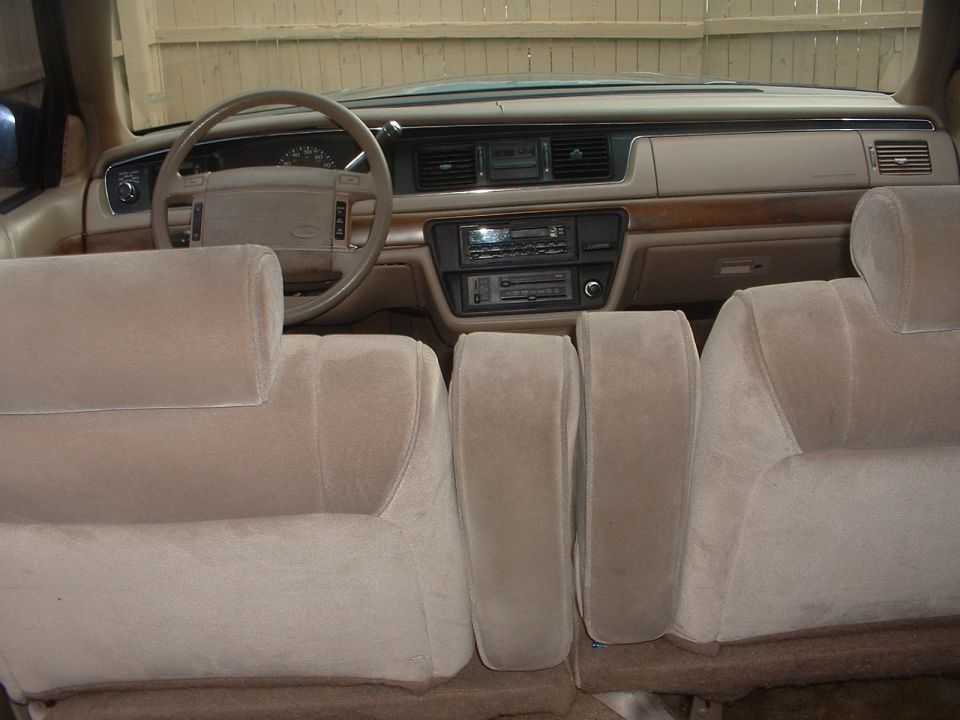 1993 Ford Crown Victoria interior showing front seats, dashboard, steering wheel, and center console
