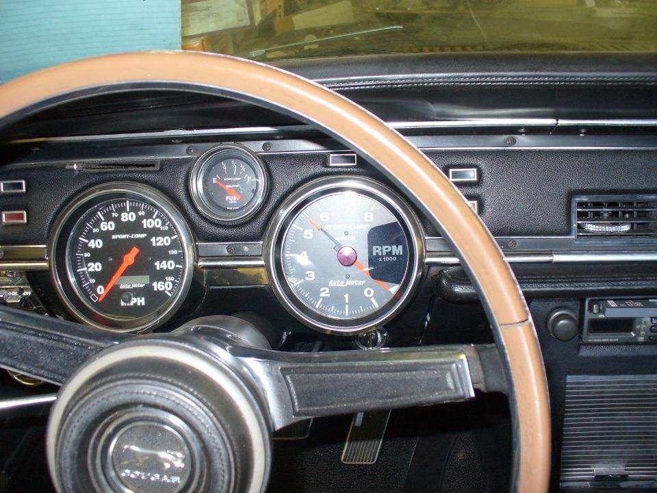 1968 Mercury Cougar interior showing dashboard with tachometer, speedometer, and fuel gauge
