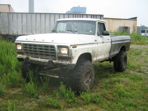 1990 Ford Bronco - This lifted Ford pickup truck appears to be from the late 1970s, not a 1990 model.