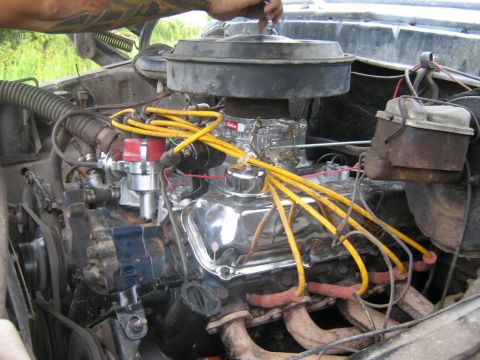 1990 Ford Bronco - Engine bay detail showing a V8 motor with various components and wiring.