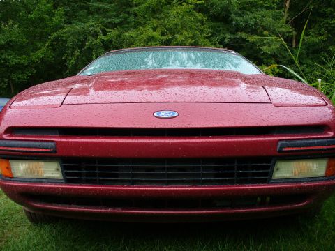 1991 Ford Probe - Front view of a red 1991 Ford Probe, showing its grille and headlights.