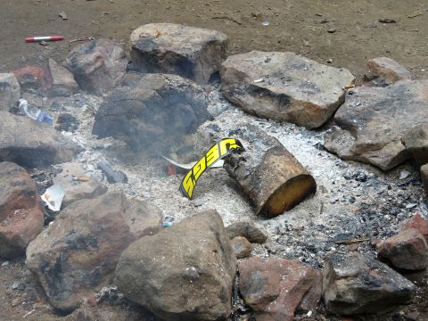 1991 Ford Probe - Debris and a yellow sticker are visible in a campfire pit.