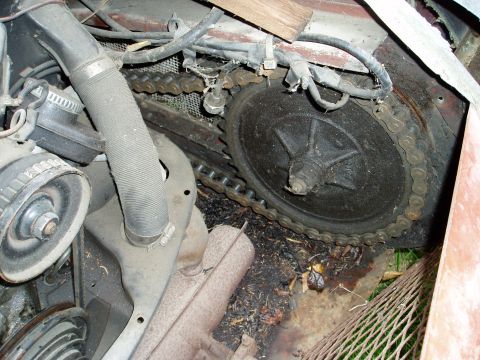 2000 Ford E350 - Engine compartment detail showing a chain and sprocket assembly.