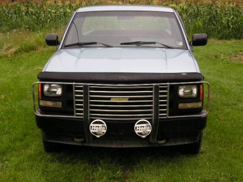 1994 Ford Probe - Front view of a light blue pickup truck with a chrome grille and fog lights.