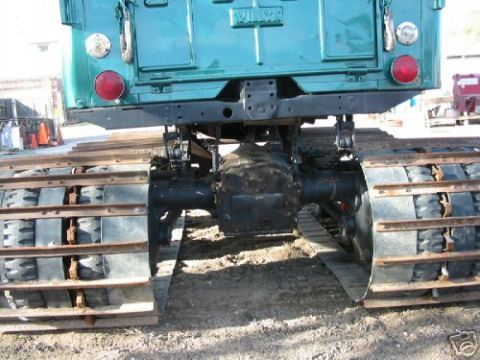 2000 Ford E350 - This tracked vehicle has a distinctive rear end with large, robust tracks for off-road use.
