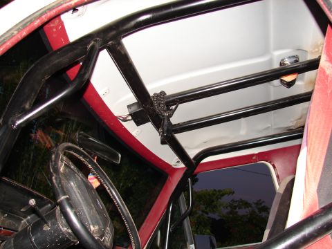 1996 Ford Bronco - Interior view shows a custom roll cage installed in the vehicle.