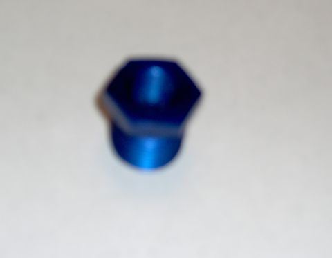 1978 Ford Bronco - A blue metal fitting with a hexagonal head and threaded end is shown against a white background.