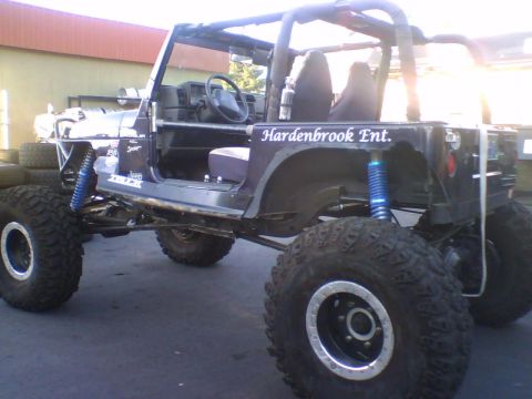 1993 Ford Bronco - This heavily modified Jeep Wrangler features oversized tires and a lifted suspension system.