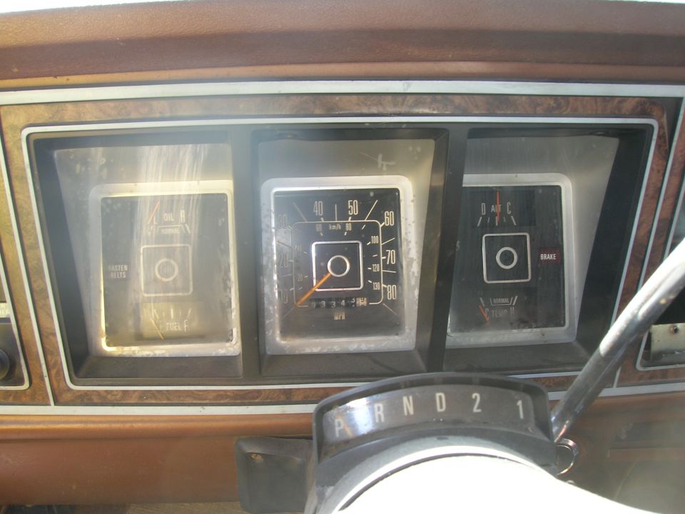 1978 Ford Bronco interior dashboard with fuel gauge, speedometer, and brake warning light