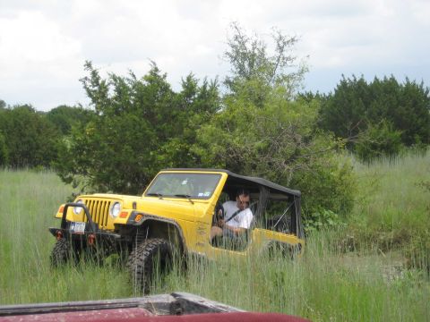 1986 Ford Bronco - playing in a small water hole
