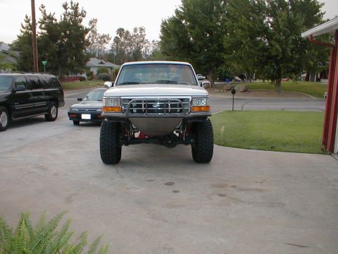 1996 Ford Bronco - Front view of a 1996 Ford Bronco modified with a custom bumper and lifted suspension.