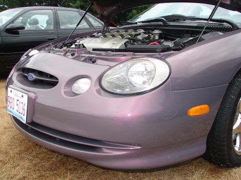 1993 Ford Taurus - This 1993 Ford Taurus is displayed with its hood open, revealing the engine compartment.