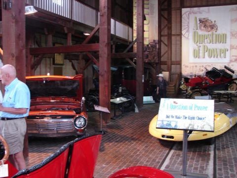 1993 Ford Taurus - A 1957 Ford Fairlane 500 Skyliner is displayed with its hood open in a museum setting.