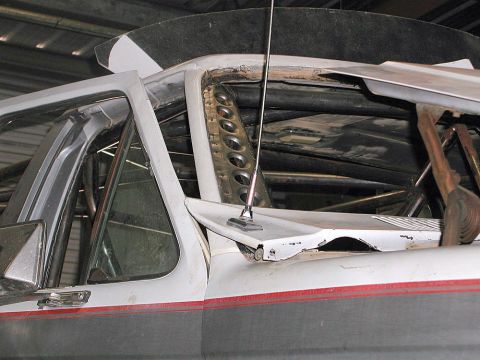 1980 Ford Bronco - Interior view of a vehicle undergoing modifications, with visible roll cage and antenna.