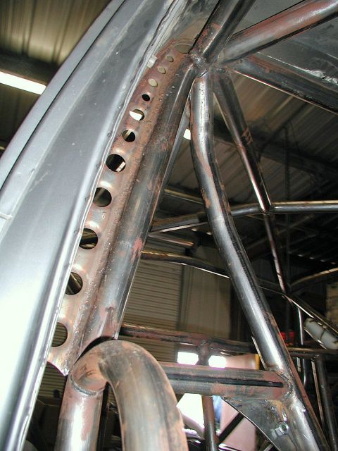1980 Ford Bronco - Custom roll cage fabrication is underway, showing the complex metalwork inside the vehicle.