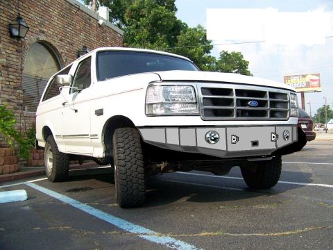 1995 Ford Bronco - This Ford Bronco has a custom front bumper with integrated lights and a winch mount.