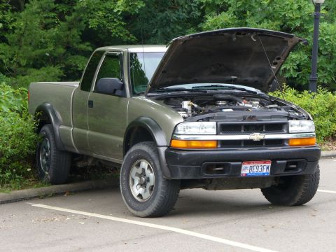 1991 Ford Probe - This Chevrolet S-10 pickup truck has its hood open, revealing the engine compartment.
