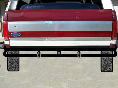 1991 Ford Bronco - Aftermarket rear bumper and tow hitch assembly installed on a vehicle.