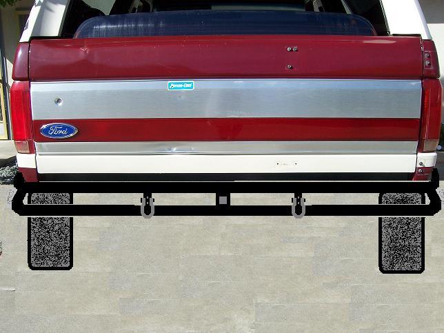 Rear bumper assembly with tow hitch and mud flaps