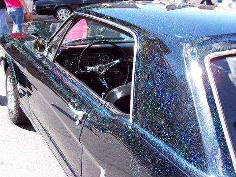 1972 Ford Ranchero - A classic car with a unique glitter paint finish is parked outdoors, with another vehicle visible in the background.