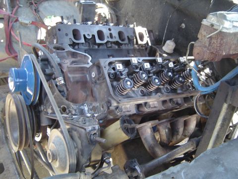 1978 Ford Bronco - Close-up view of a V8 engine, showing internal components and exhaust system.