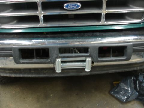 1996 Ford Bronco - Front view of a Ford truck with a winch mounted on the bumper.