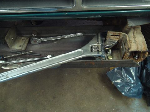 1996 Ford Bronco - Tools are laid out on a metal surface, possibly for a vehicle repair or installation.