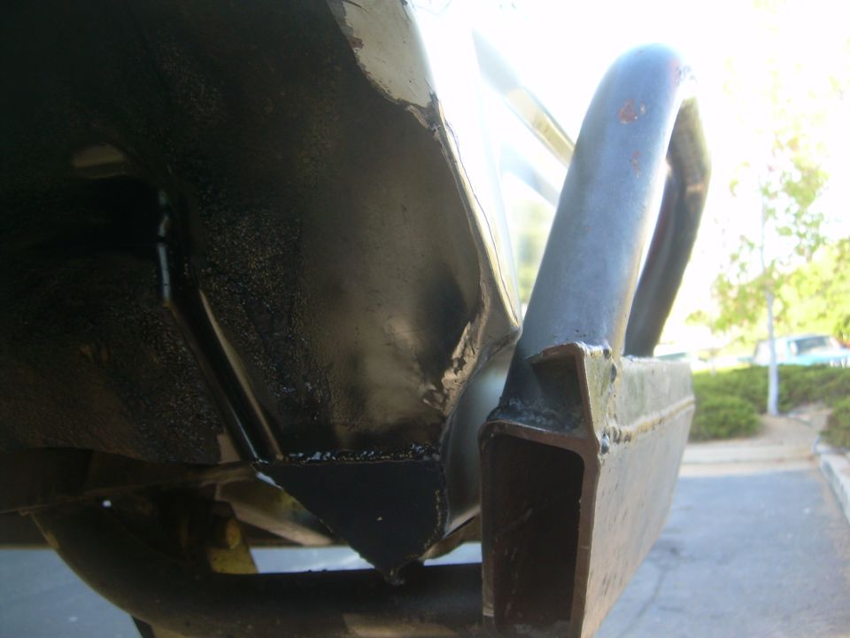 Close-up of custom steel bumper and vehicle frame, showing welds and undercarriage