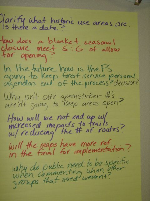 1986 Ford Bronco - Handwritten questions on a yellow poster board discuss forest service policies and trail usage impacts.