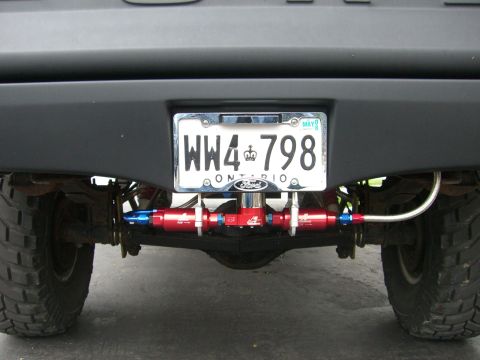 1977 Ford F-150 - Aeromotive fuel pump and filters. Custom aluminum bracket holds assembly.