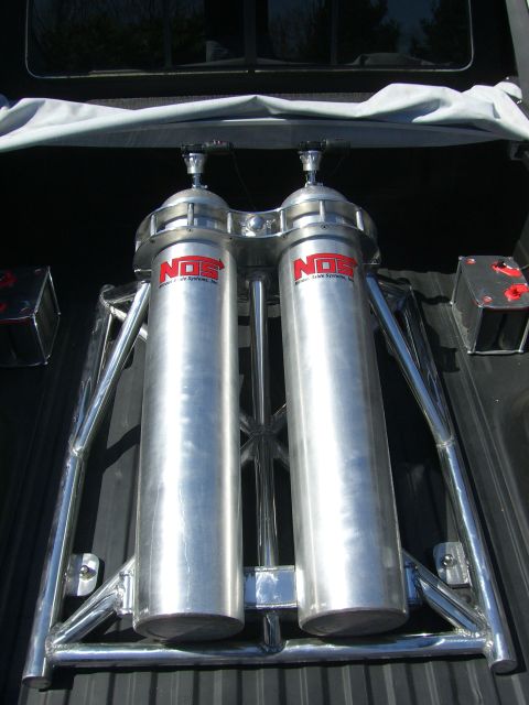 1977 Ford F-150 - Final product, custom aluminum cradle holding two 50# nitrous bottles with NOS high flow valves and Cold Fusion remote bottle openers. Bott…