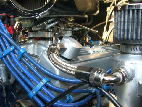 1977 Ford F-150 - Custom engine components are visible in this close-up shot of a vehicle's engine bay.