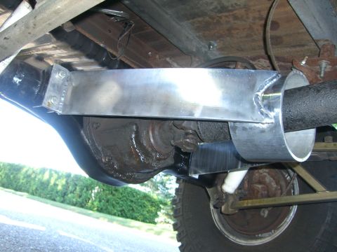 1977 Ford F-150 - Close-up of the rear axle and suspension system, showing aftermarket modifications.