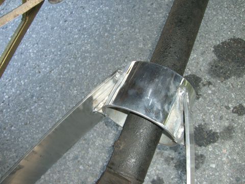 1977 Ford F-150 - A custom-made, polished metal clamp secures an exhaust pipe.