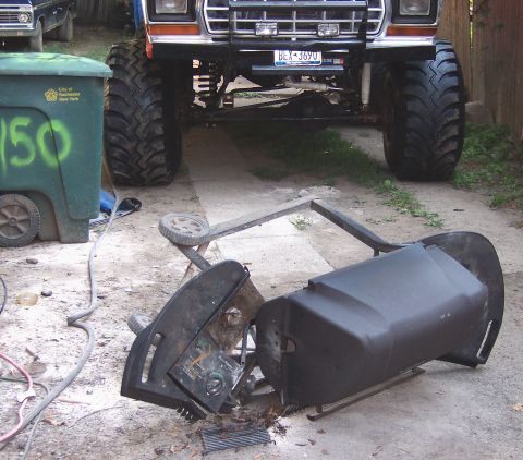 1978 Ford Bronco - A lifted 1978 Ford Bronco is parked on a driveway, with a damaged grill in the foreground.