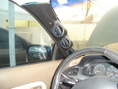 1995 Mazda MX-6 - A 1995 Mazda MX-6 interior shows a custom gauge pod on the A-pillar and a view of the dashboard.