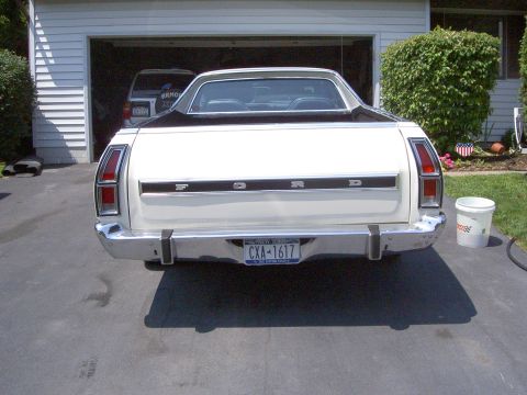 1972 Ford Ranchero - Rear view of a white 1972 Ford Ranchero with a black top parked in a driveway.