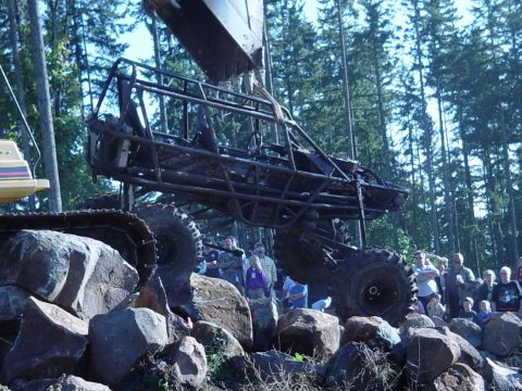 1989 Ford Bronco - The backhoe picks up the rockbuggy after it breaks a driveline