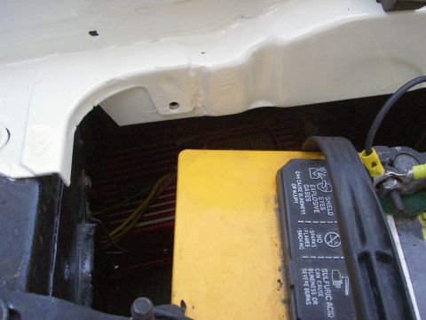 1972 Ford Ranchero - Close-up of a car battery and surrounding engine bay components.