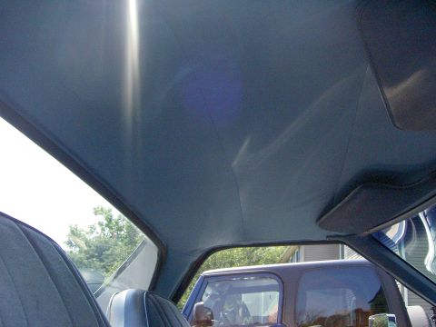 1972 Ford Ranchero - View from inside a vehicle, showing the headliner and a glimpse of another vehicle.