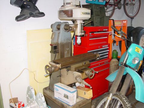 1994 Ford Bronco - A turquoise motorcycle is partially visible next to a milling machine and tool chest.