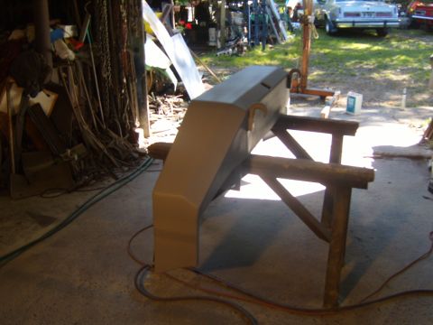 1989 Ford Bronco - Front bumper for a Ford Bronco, undergoing preparation for a new paint job in a workshop setting.