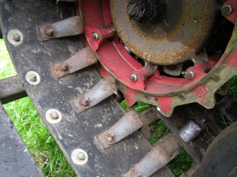 2000 Ford E350 - Snowmobile track detail showing metal cleats and drive sprocket.