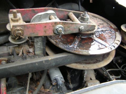 2000 Ford E350 - This is a close-up view of a rusty brake drum and caliper assembly, likely from an older vehicle.