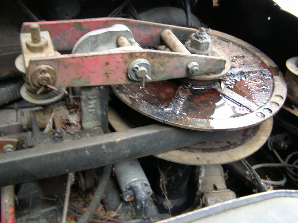 close-up of rusty brake drum and caliper assembly