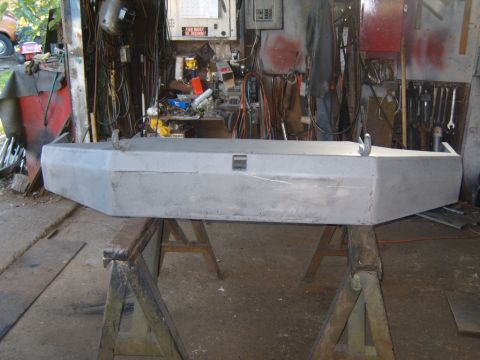 1989 Ford Bronco - Custom front bumper undergoing bodywork in a garage setting.